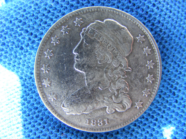 1st generation early 1831, small letters, Capped Bust Quarter Dollar, front view.