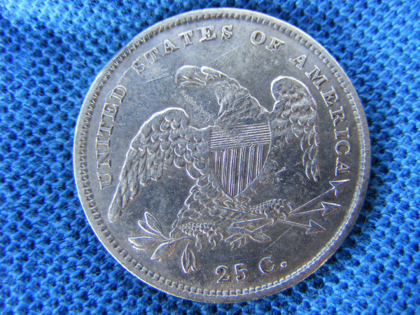 1st generation early 1831, small letters, Capped Bust Quarter Dollar, back view.