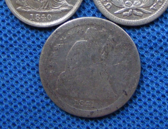 A 1841 'O' dime with approx 11 years of circulation/wear.