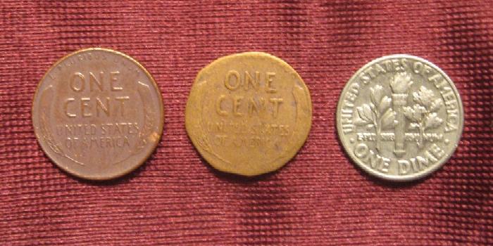 A full sized penny, the 'shaved' penny and a 
dime